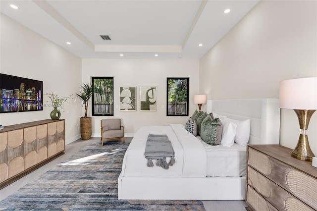 bedroom featuring a raised ceiling