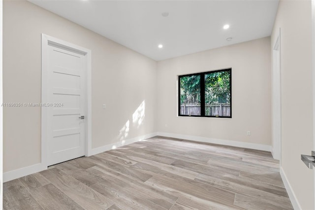 spare room with light wood-type flooring