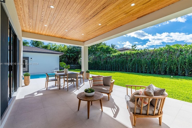 view of patio / terrace featuring an outdoor hangout area and a fenced in pool