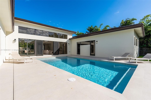 view of swimming pool featuring a patio area