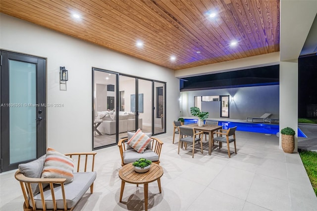 interior space with french doors and wood ceiling