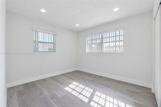 spare room featuring light hardwood / wood-style flooring