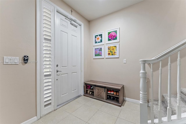 foyer entrance featuring light tile patterned flooring