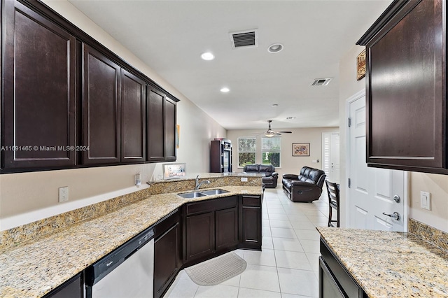 kitchen with dishwasher, ceiling fan, light stone countertops, and sink