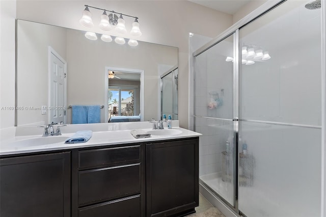 bathroom featuring vanity, ceiling fan, and walk in shower