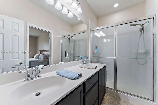 bathroom with vanity and an enclosed shower