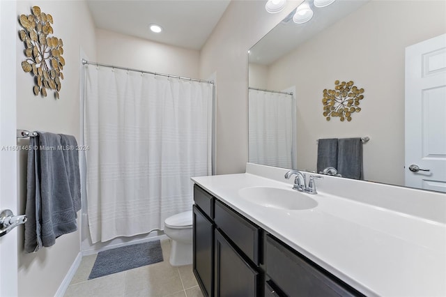 full bathroom with tile patterned floors, vanity, toilet, and shower / bath combo with shower curtain