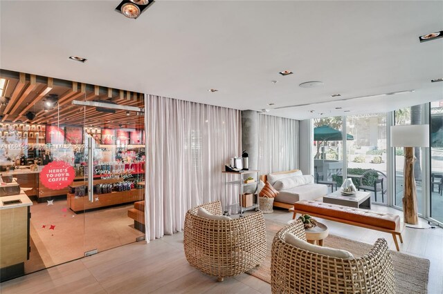 interior space with bar and floor to ceiling windows