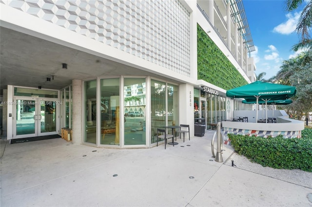 6080 Collins Ave Unit 102, Miami Beach, FL 33140 - view of patio featuring french doors