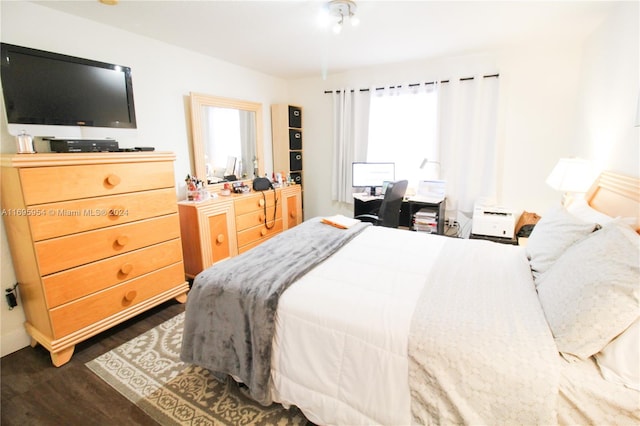 bedroom featuring dark hardwood / wood-style flooring