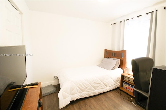 bedroom with wood-type flooring