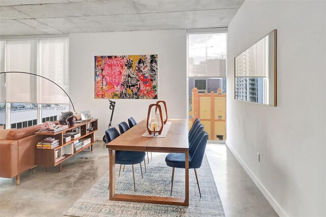 dining area featuring concrete floors