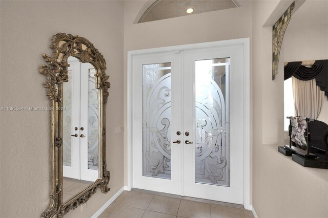 tiled foyer with french doors