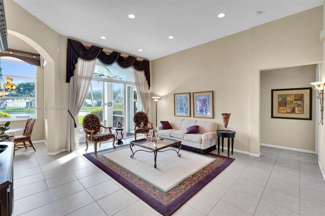 tiled living room featuring french doors