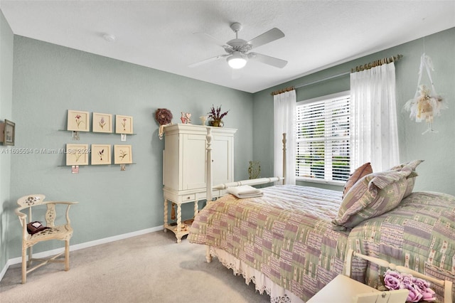 bedroom featuring ceiling fan and light colored carpet