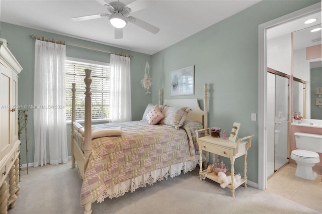 bedroom with ceiling fan and light carpet