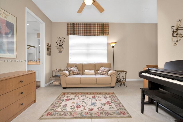 tiled living room featuring ceiling fan