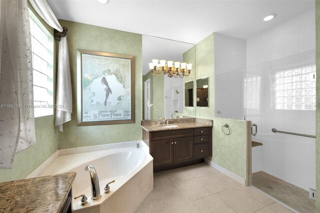 bathroom with tile patterned floors, vanity, separate shower and tub, and plenty of natural light