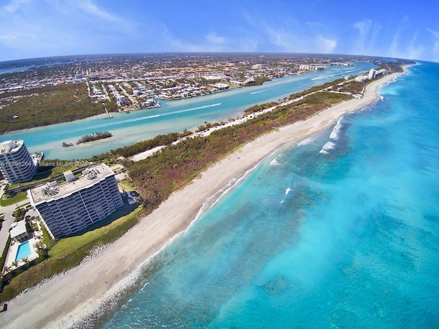 birds eye view of property featuring a view of the beach and a water view