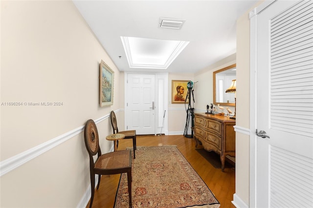 hallway with hardwood / wood-style floors