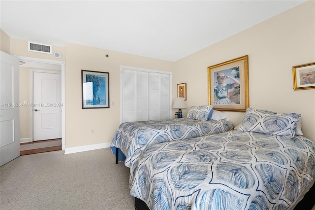 bedroom with carpet and a closet