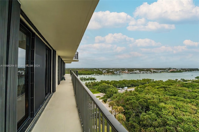 balcony featuring a water view