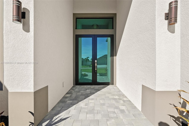 property entrance featuring french doors