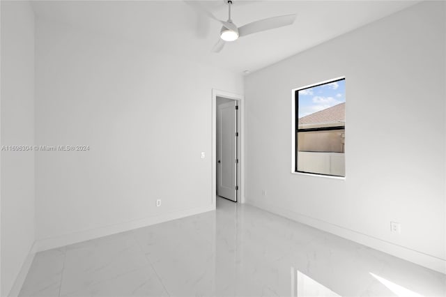 spare room with ceiling fan