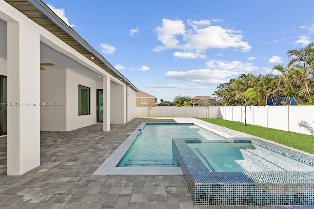 view of swimming pool featuring an in ground hot tub