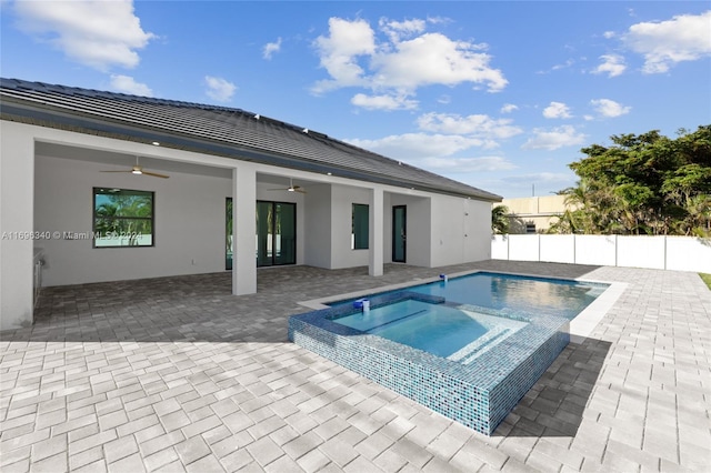 view of pool featuring an in ground hot tub, ceiling fan, and a patio