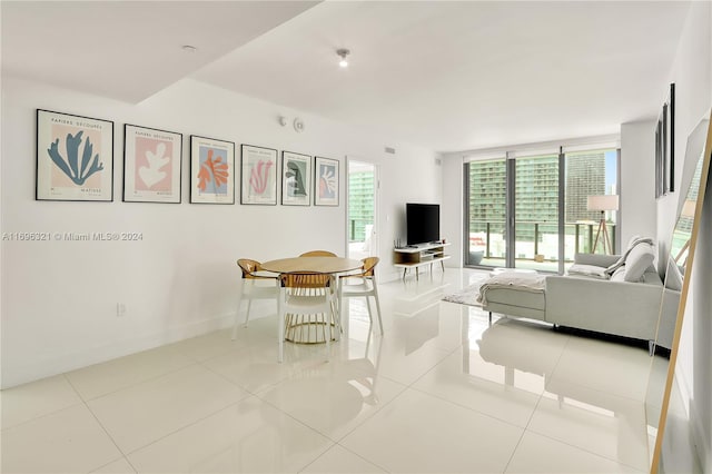 unfurnished living room featuring light tile patterned floors