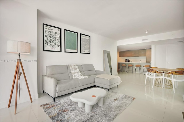 living room with light tile patterned flooring