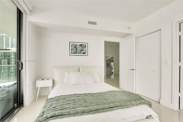 bedroom with light tile patterned flooring