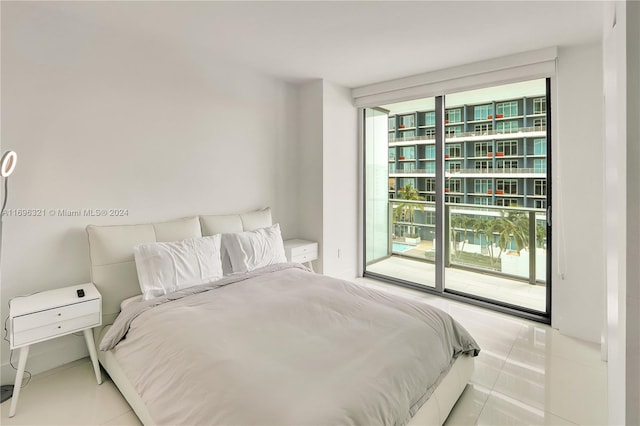 tiled bedroom featuring access to exterior