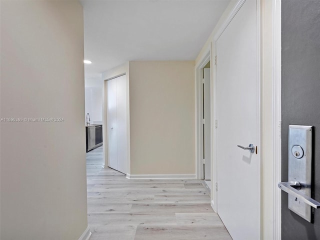 hallway featuring light wood-type flooring