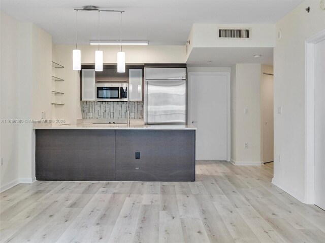 spare room with light hardwood / wood-style floors