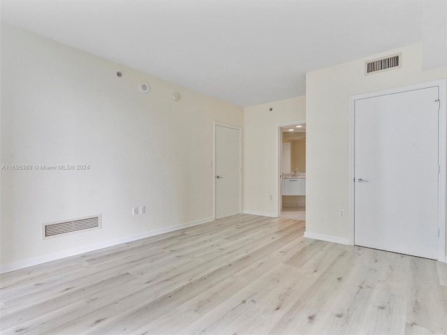 empty room with light wood-type flooring