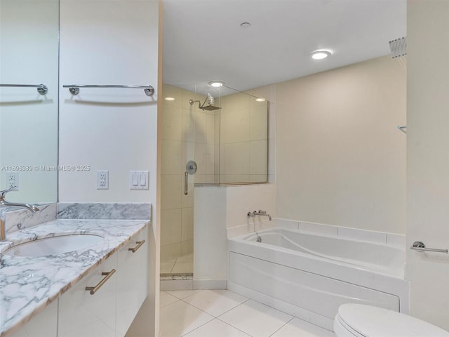 full bathroom featuring vanity, tile patterned floors, independent shower and bath, and toilet