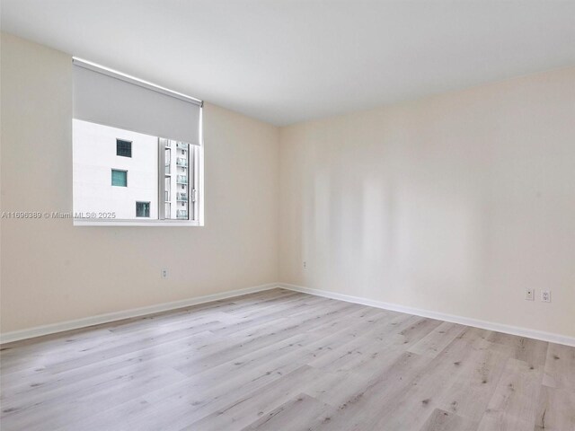 unfurnished bedroom featuring light wood-type flooring