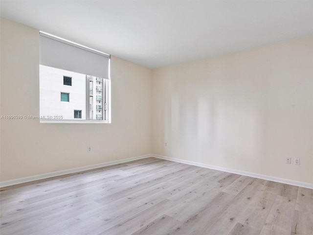 unfurnished room featuring light hardwood / wood-style floors