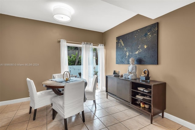 dining space with light tile patterned floors