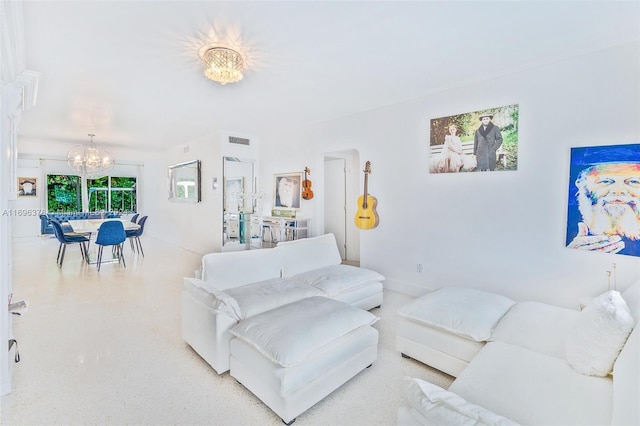 living room featuring a notable chandelier