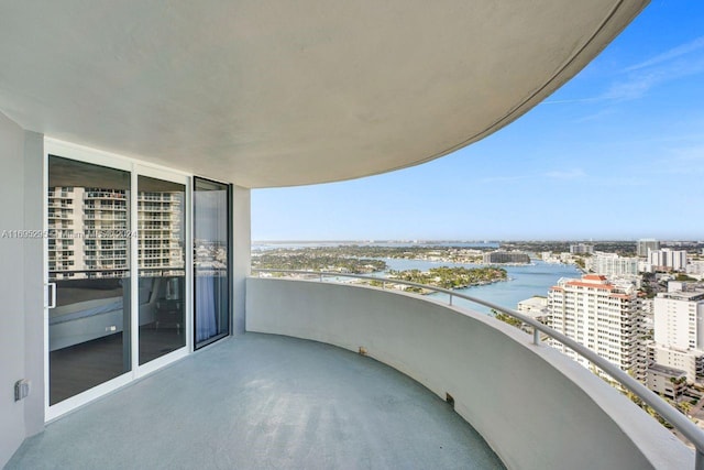 balcony featuring a water view