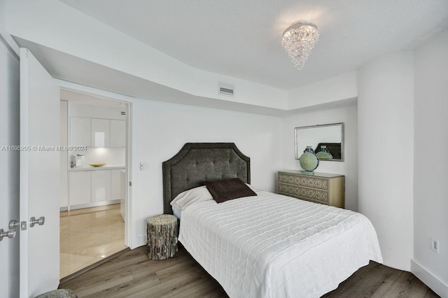 bedroom with dark hardwood / wood-style flooring