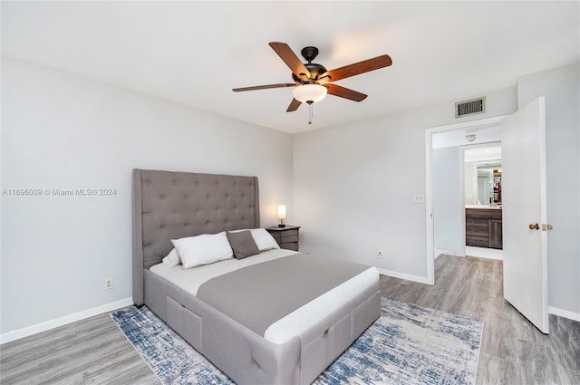 bedroom featuring hardwood / wood-style flooring and ceiling fan