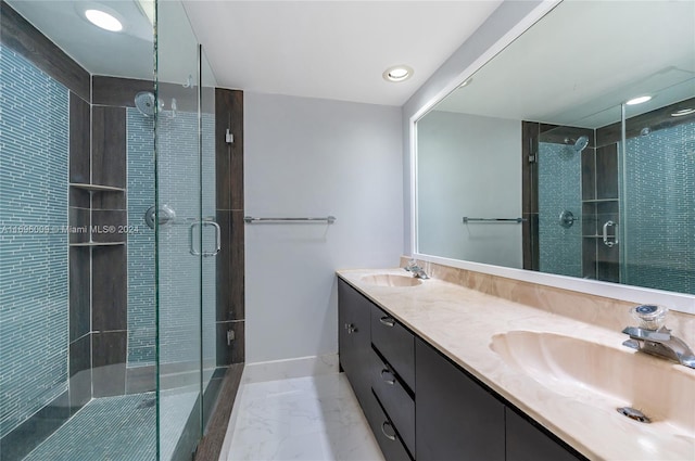 bathroom with vanity and an enclosed shower