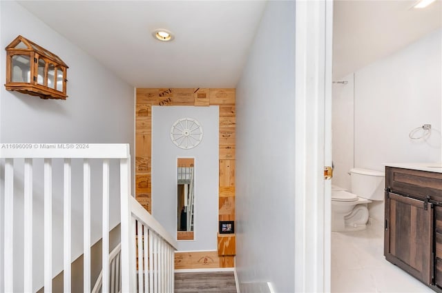 hall with light hardwood / wood-style flooring