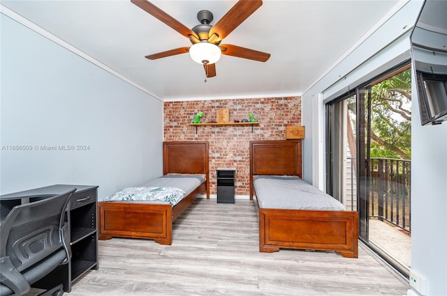 bedroom featuring access to exterior, ornamental molding, brick wall, ceiling fan, and light hardwood / wood-style floors