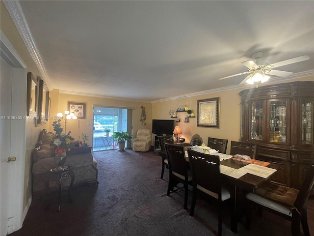 carpeted dining room featuring ceiling fan and crown molding