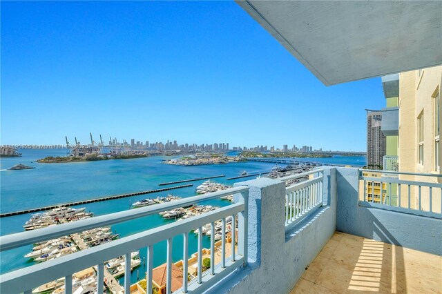 balcony featuring a water view